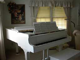 Ivory Grand with Small Music Stand Piano Before